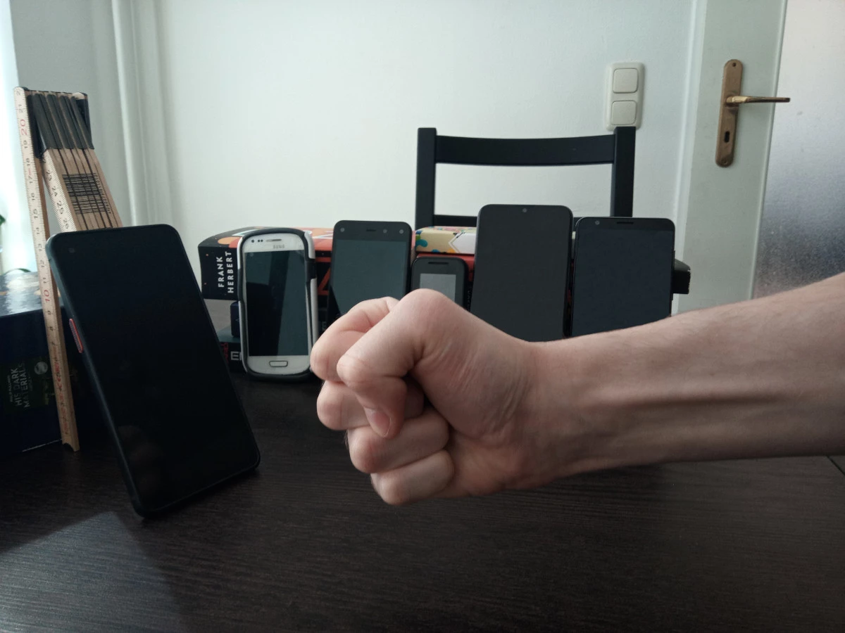 group of phones behind XCover Pro and a menacing fist