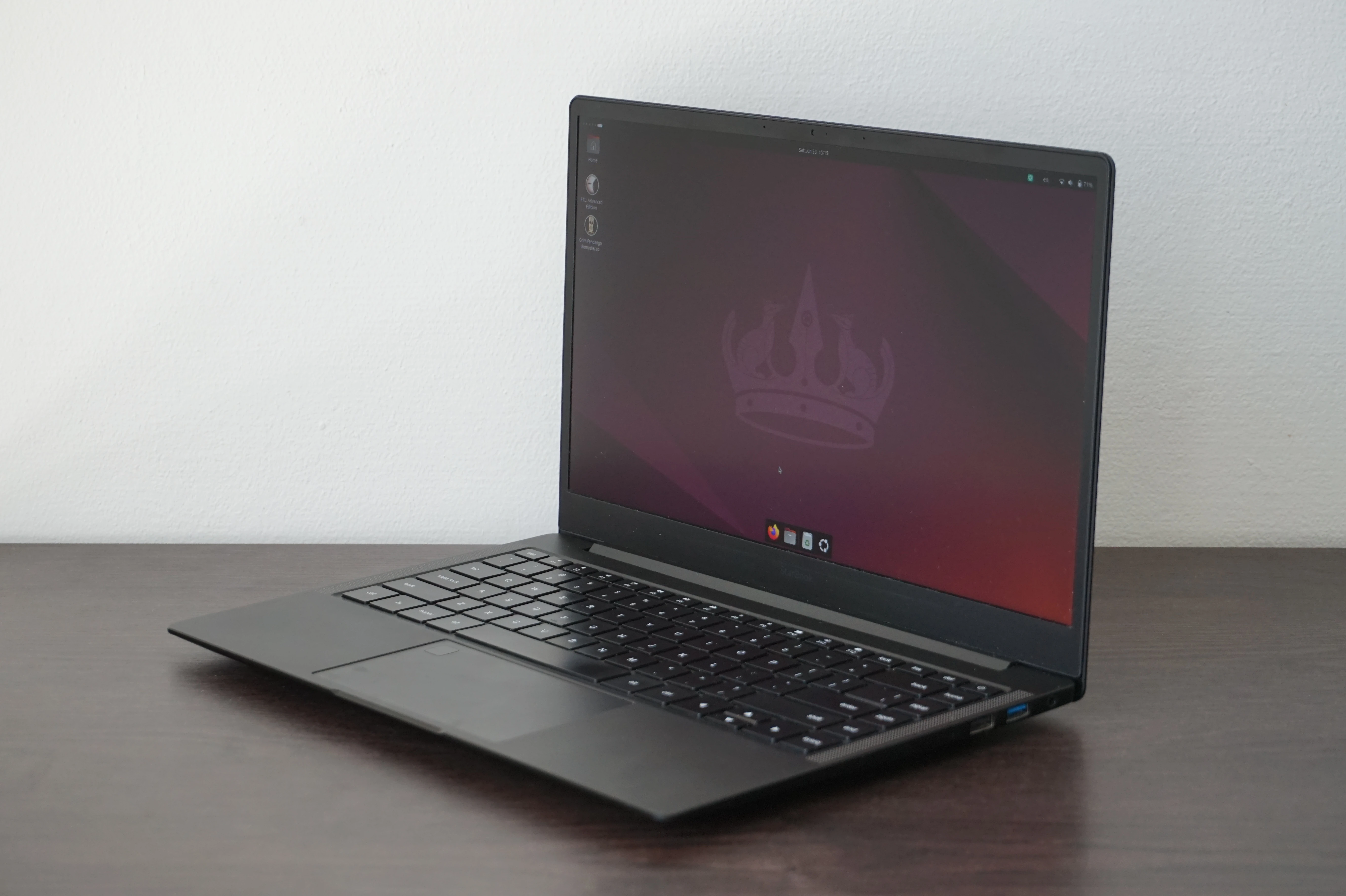 Starlabs Starbook VI sitting at an angle, with the Ubuntu desktop on display